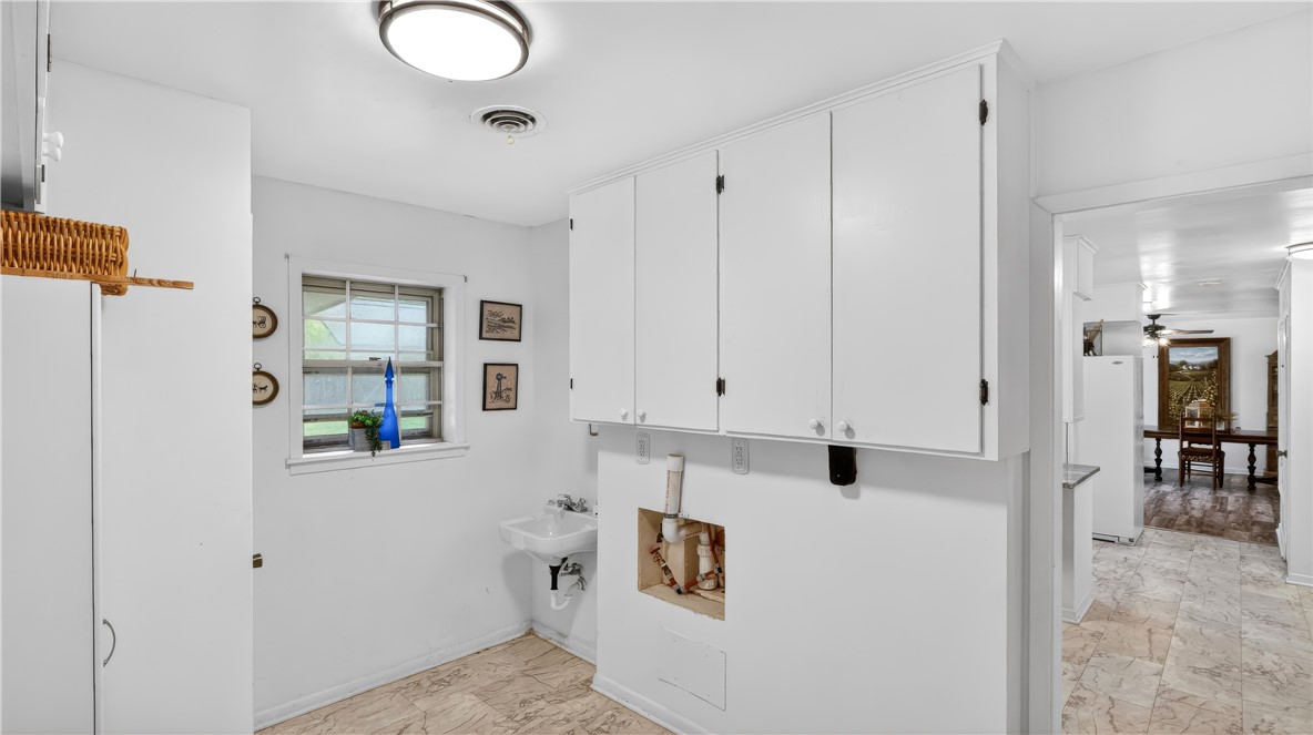 405 North Main Street Franklin, TX 77856 - Photo 17 of 28 a view of kitchen with furniture and wooden floor