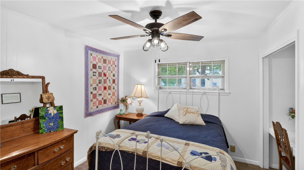 405 North Main Street Franklin, TX 77856 - Photo 19 of 28 a bedroom with a bed and wooden floor