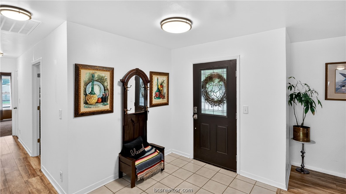 405 North Main Street Franklin, TX 77856 - Photo 4 of 28 a view of an entryway with wooden floor