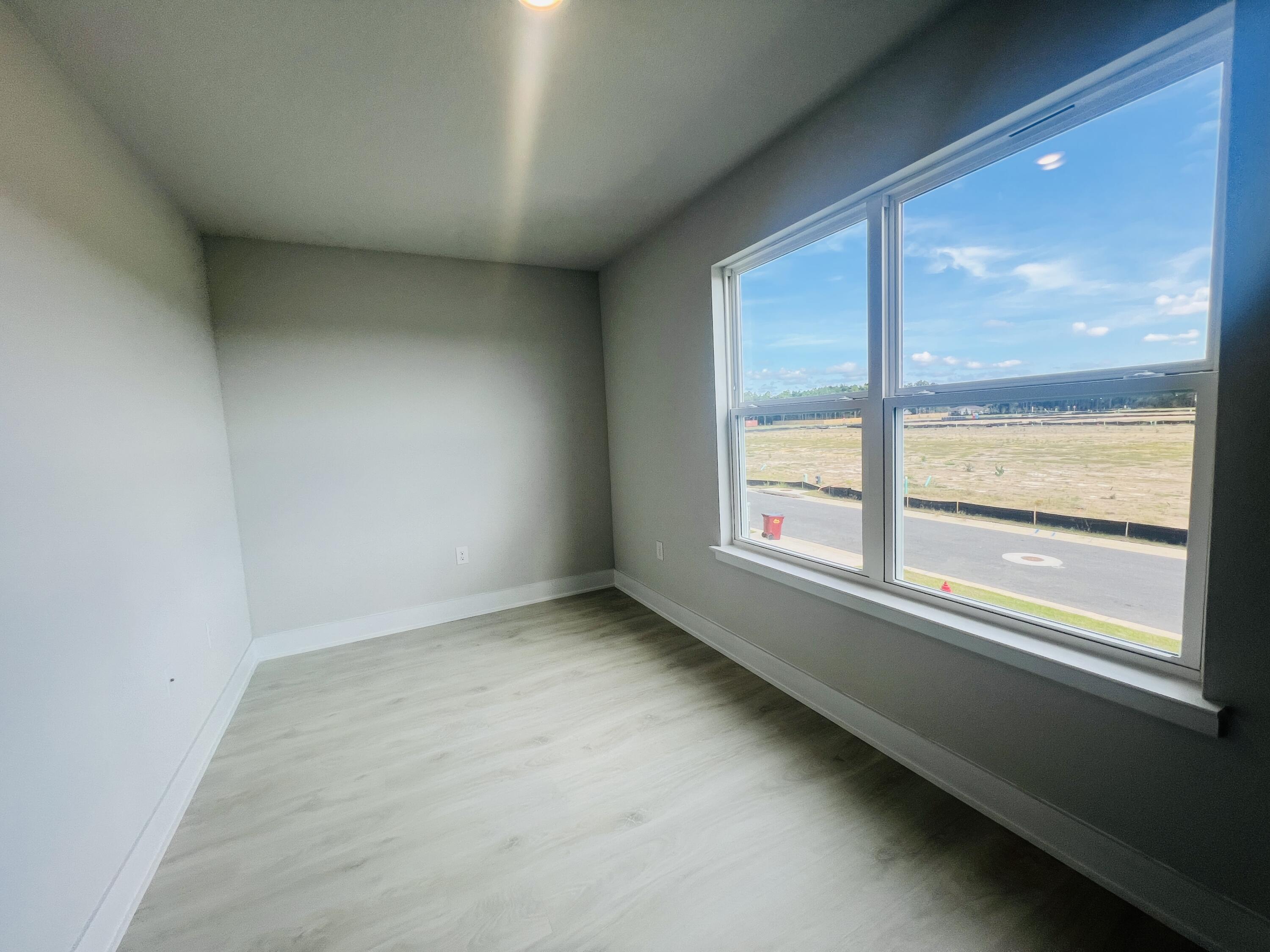 5291 Hidden Pines Circle Milton, FL 32583 - Photo 11 of 21 an empty room with a window
