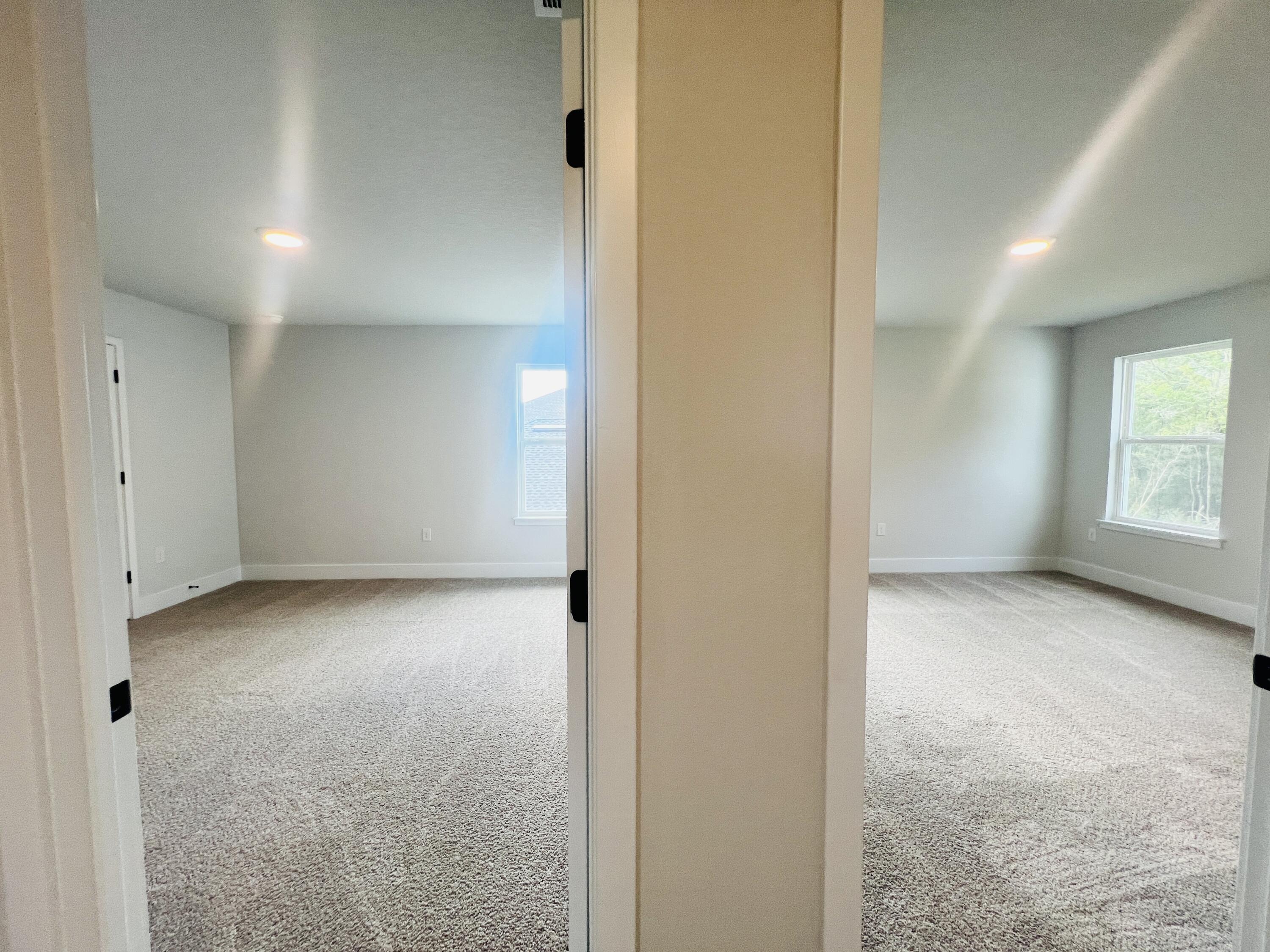 5291 Hidden Pines Circle Milton, FL 32583 - Photo 16 of 21 an empty room with windows