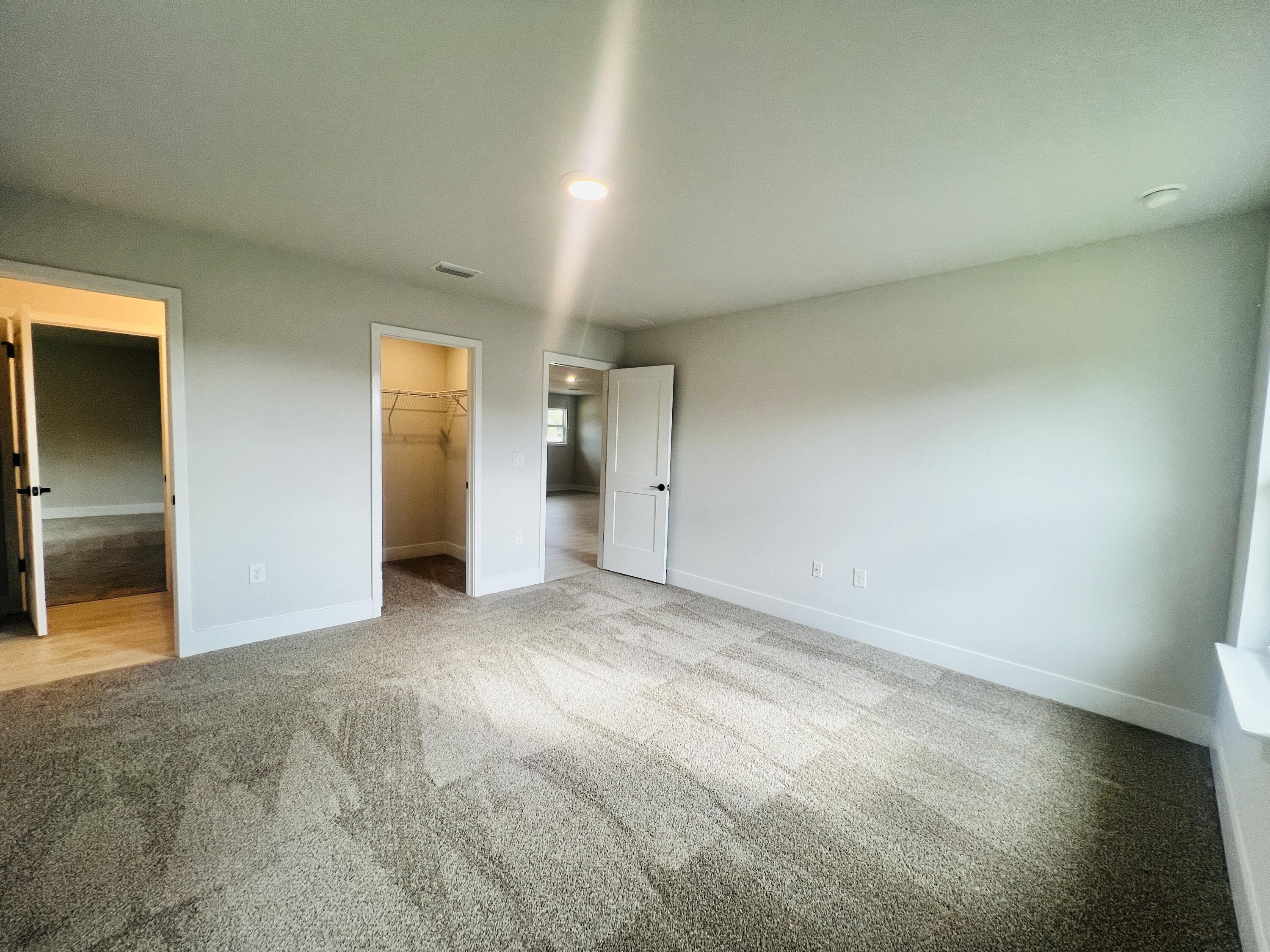 5291 Hidden Pines Circle Milton, FL 32583 - Photo 20 of 21 an empty room with a natural light