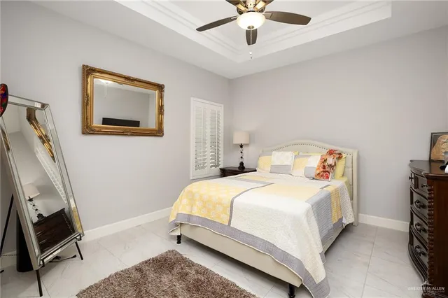 a bedroom with a bed and a mirror