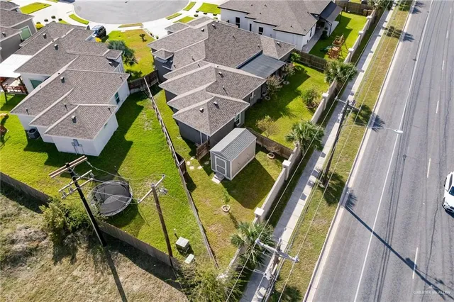 an aerial view of a house with a garden and stairs