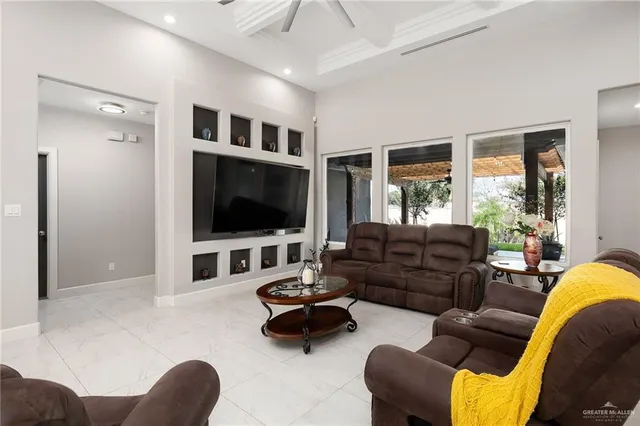 a living room with furniture and a flat screen tv