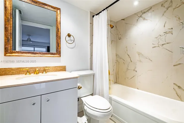 a bathroom with a sink a toilet and a bathtub