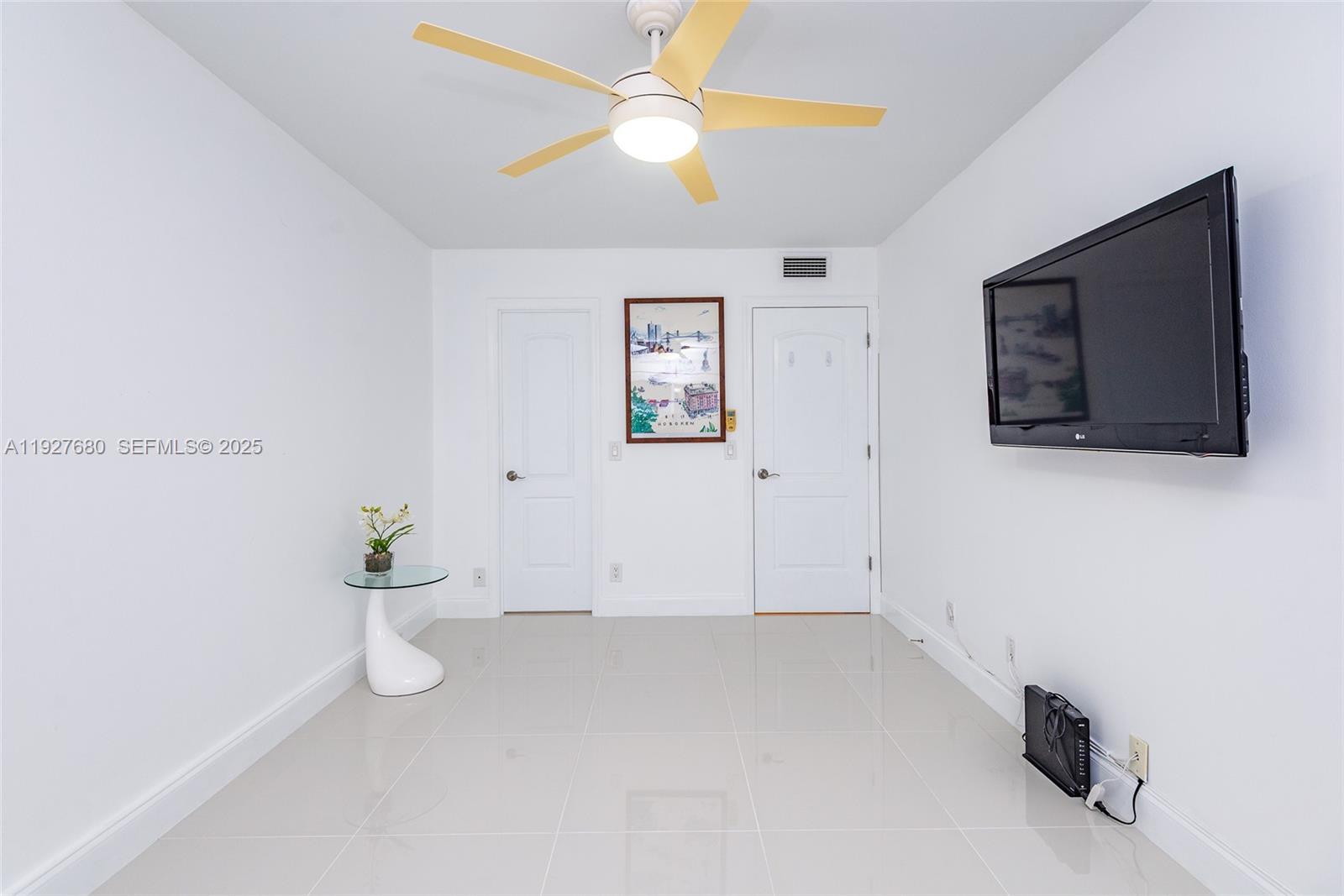 1061 Exeter, Unit 1061D Boca Raton, FL 33434 - Photo 19 of 32 a view of room with window and ceiling fan