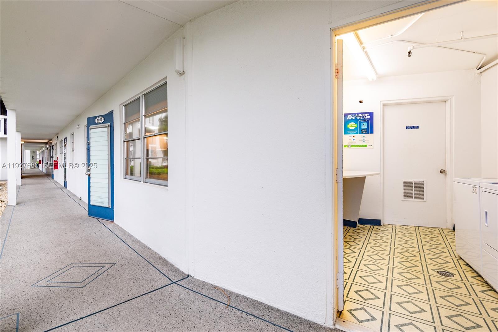 1061 Exeter, Unit 1061D Boca Raton, FL 33434 - Photo 29 of 32 a bathroom with a sink and a mirror