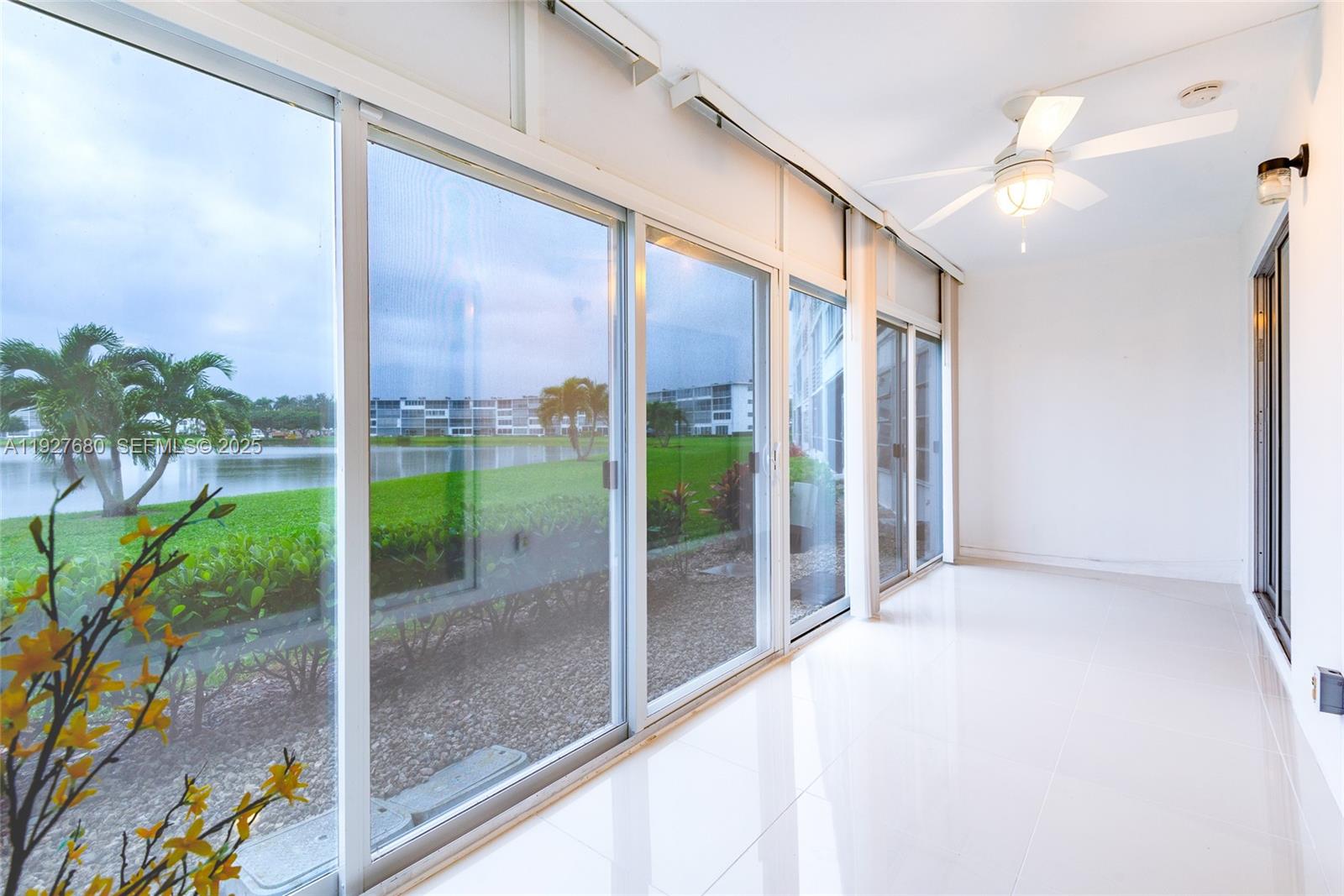 1061 Exeter, Unit 1061D Boca Raton, FL 33434 - Photo 3 of 32 a view of a glass door and porch