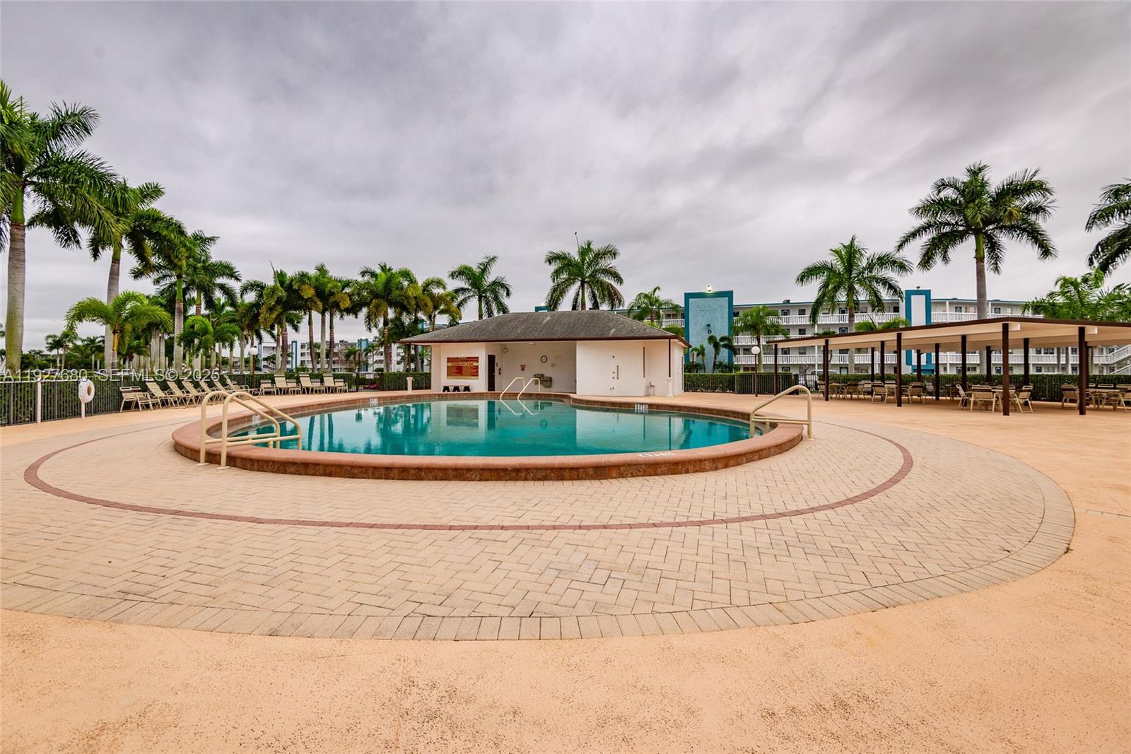 1061 Exeter, Unit 1061D Boca Raton, FL 33434 - Photo 32 of 32 a view of swimming pool with a yard