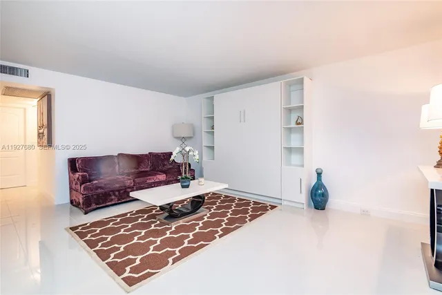 a living room with furniture and a rug