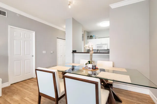 a dining room with a table and chairs