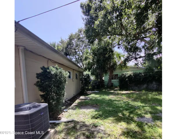 a utility room with multiple dryer and washer