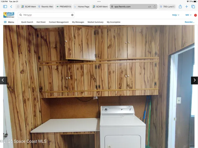 a large kitchen with cabinets and stainless steel appliances