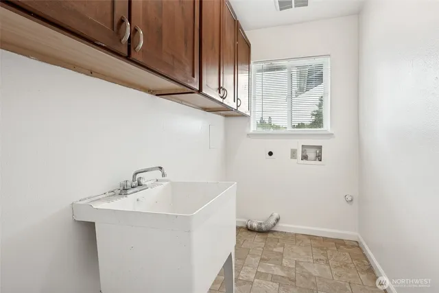 a bathroom with a sink and a window