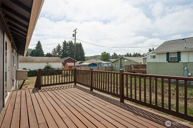 a view of a balcony with wooden floor