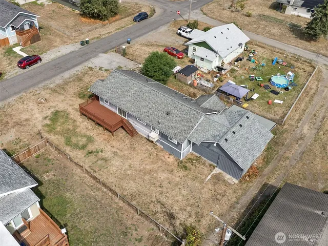 an aerial view of a house a yard and wooden floor