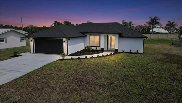 a front view of a house with a yard