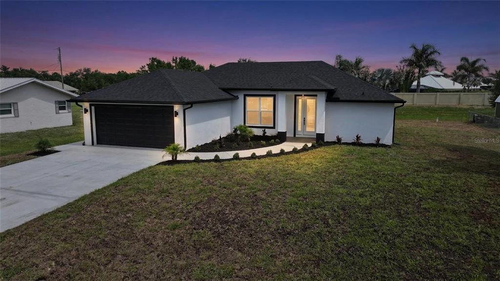a front view of a house with a yard