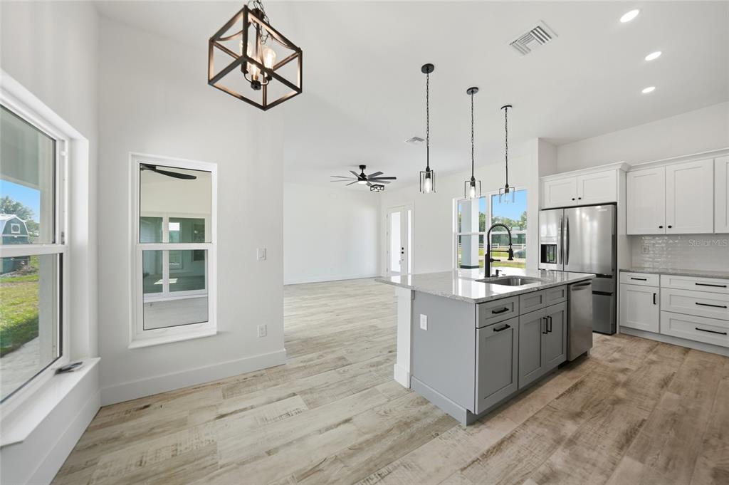 8846 Southwest Liverpool Road Arcadia, FL 34269 - Photo 12 of 49 a kitchen with stainless steel appliances a stove a refrigerator and a sink