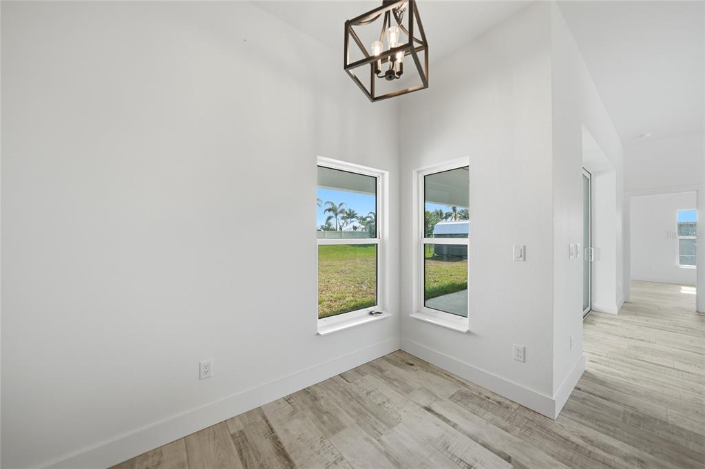8846 Southwest Liverpool Road Arcadia, FL 34269 - Photo 15 of 49 wooden floor in an empty room with a window