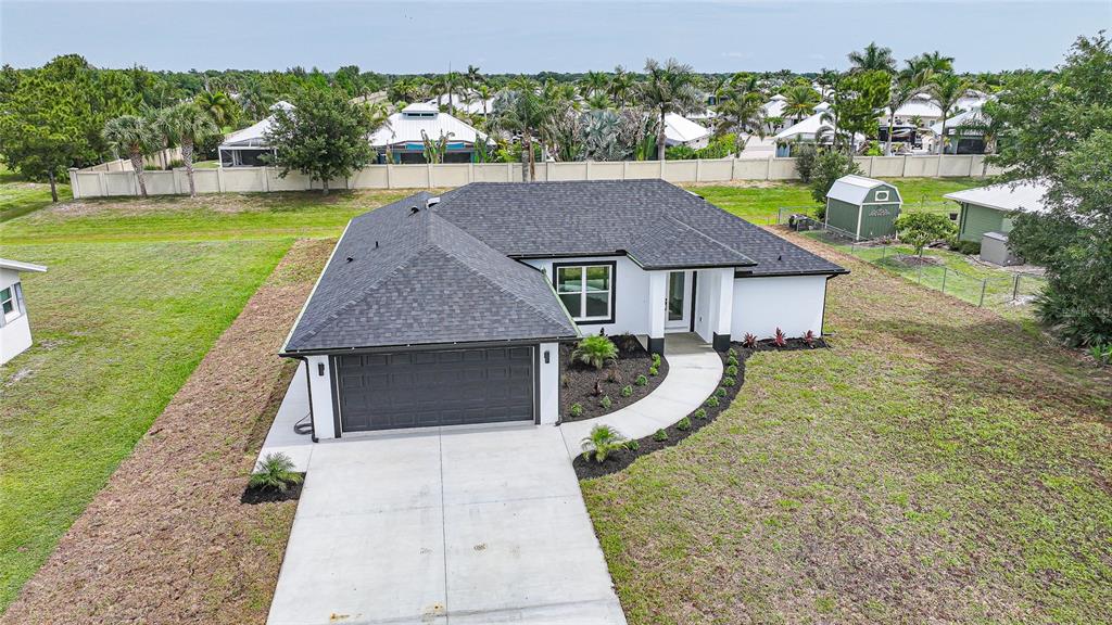 8846 Southwest Liverpool Road Arcadia, FL 34269 - Photo 2 of 49 a front view of a house with a yard table and chairs
