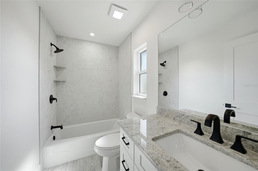 8846 Southwest Liverpool Road Arcadia, FL 34269 - Photo 21 of 49 a bathroom with a sink a toilet and shower