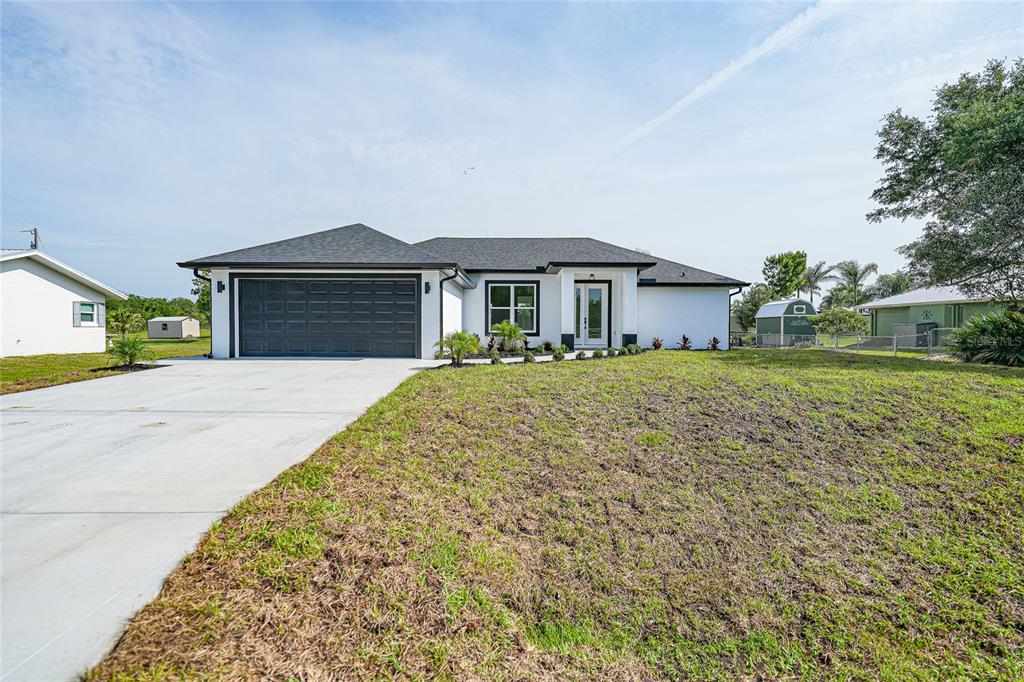 8846 Southwest Liverpool Road Arcadia, FL 34269 - Photo 35 of 49 a front view of a house with a yard