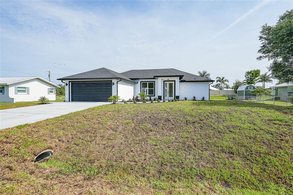 8846 Southwest Liverpool Road Arcadia, FL 34269 - Photo 37 of 49 a front view of a house with garden