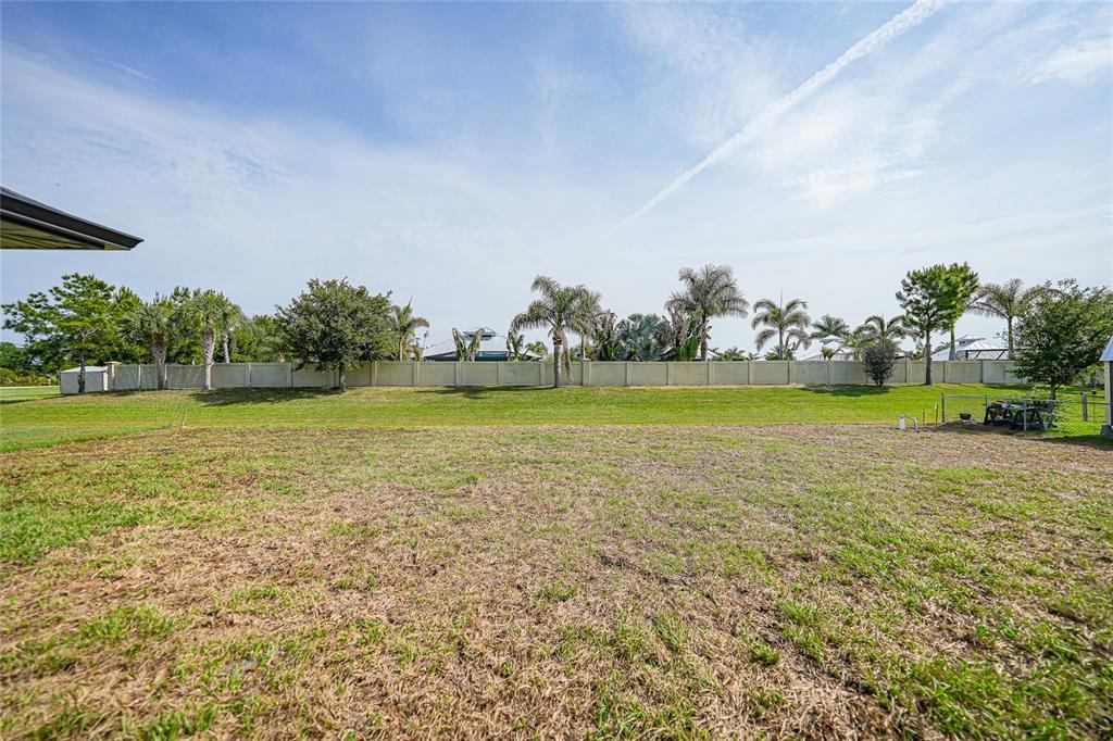 8846 Southwest Liverpool Road Arcadia, FL 34269 - Photo 38 of 49 a view of a swimming pool and trees in the background