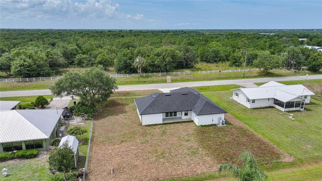 8846 Southwest Liverpool Road Arcadia, FL 34269 - Photo 41 of 49 an aerial view of a house with swimming pool and garden