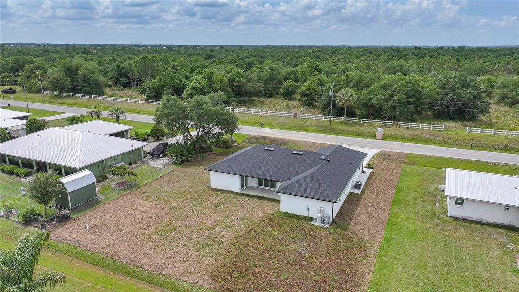 8846 Southwest Liverpool Road Arcadia, FL 34269 - Photo 43 of 49 an aerial view of a house with a yard