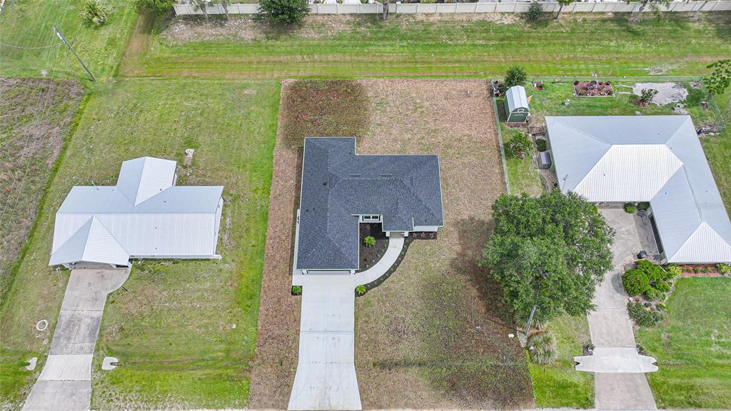 8846 Southwest Liverpool Road Arcadia, FL 34269 - Photo 44 of 49 an aerial view of a house with a garden and lake view