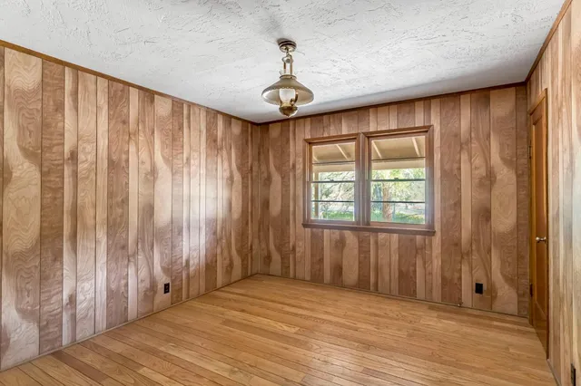 a very nice looking room with a large window and walk in closet