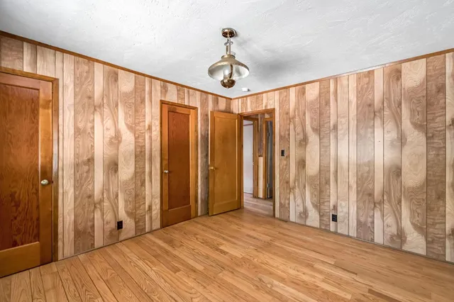 a bathroom with a double vanity sink toilet mirror and bathtub