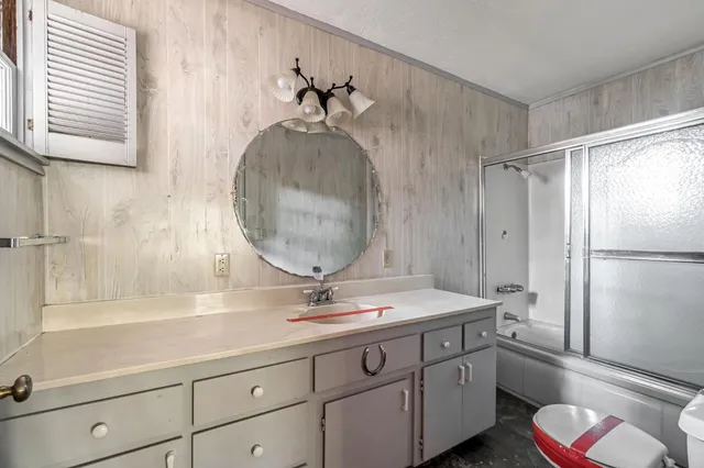 wooden floor in an empty room with a fireplace