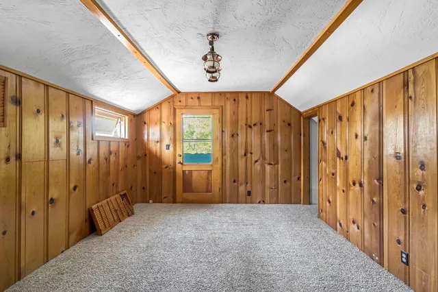 a balcony with wooden floor and fence