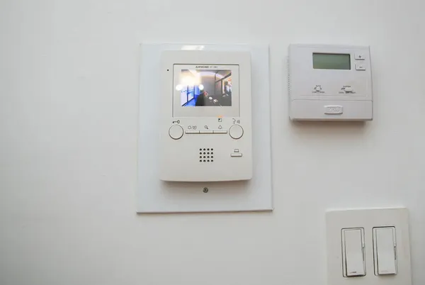 a view of a patio with table and chairs and potted plants