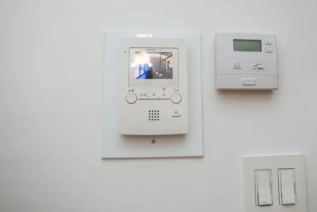 a view of a patio with table and chairs and potted plants