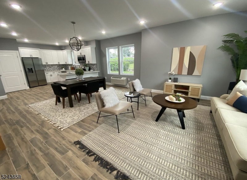 825 Allwood Road, Unit A Clifton, NJ 07012 - Photo 2 of 11 a living room with furniture and view of kitchen
