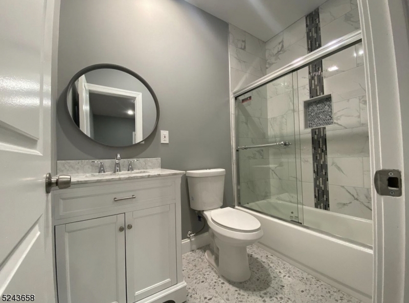 825 Allwood Road, Unit A Clifton, NJ 07012 - Photo 7 of 11 a bathroom with a toilet sink and shower