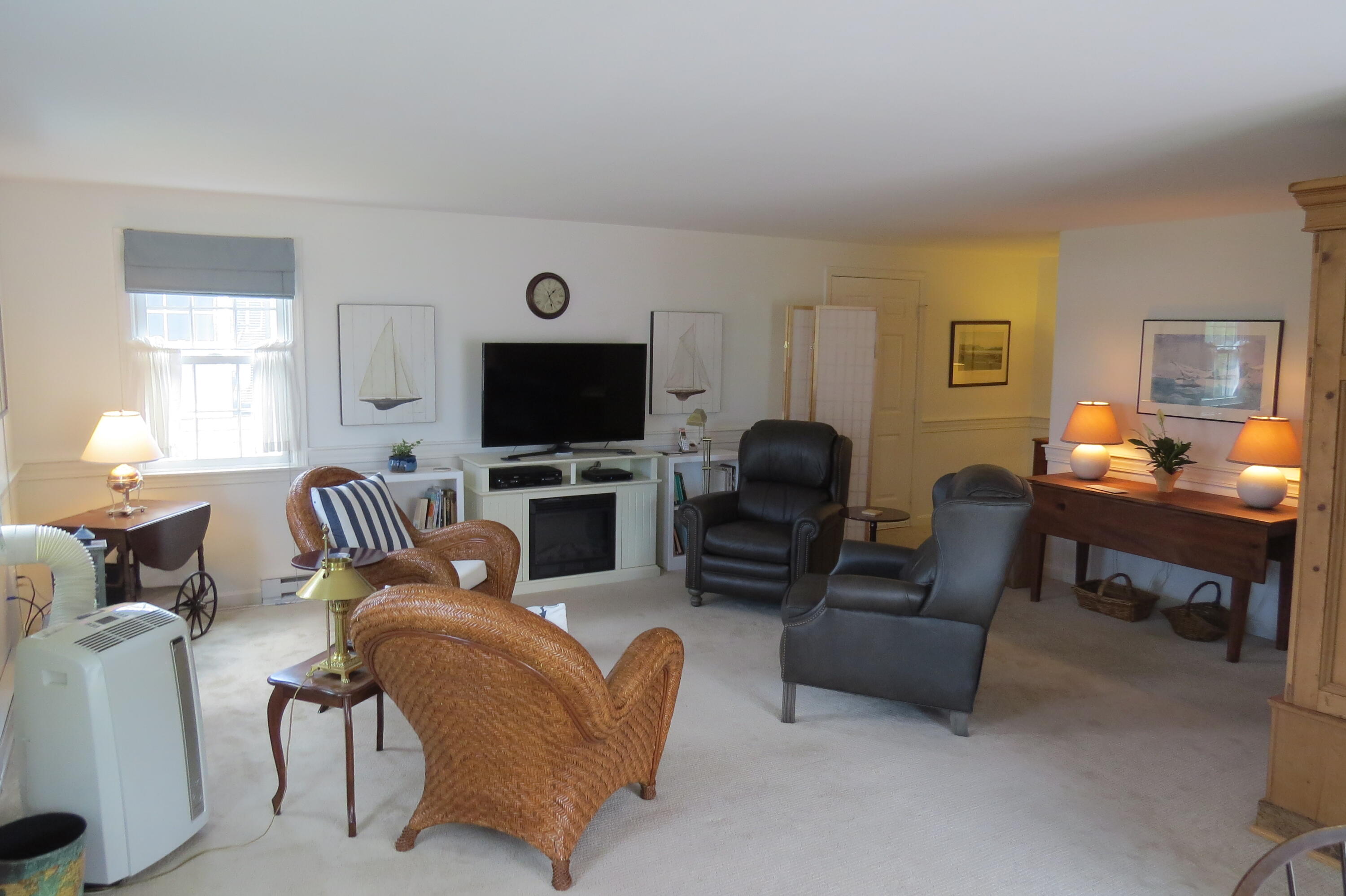 95 Depot Road, Unit 17 Chatham, MA 02633 - Photo 3 of 24 a living room with furniture and a flat screen tv