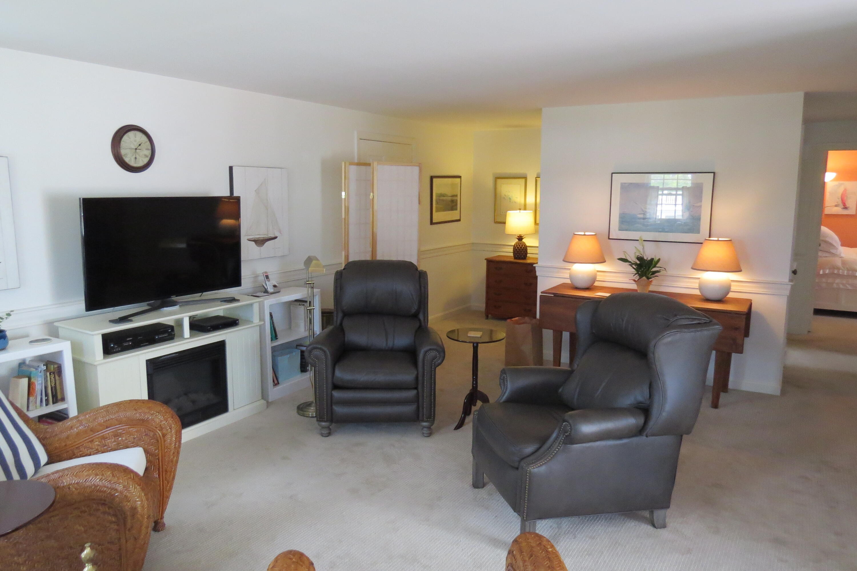 95 Depot Road, Unit 17 Chatham, MA 02633 - Photo 4 of 24 a living room with furniture and a flat screen tv