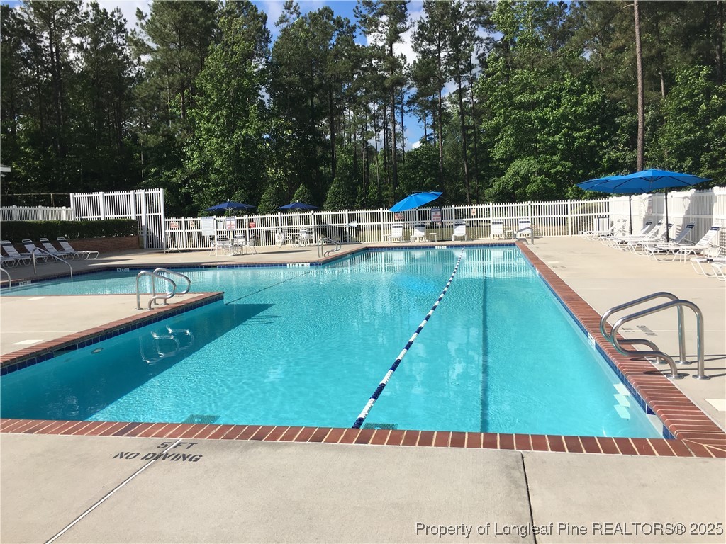 102 Graduate Court Durham, NC 27713 - Photo 7 of 20 a view of a swimming pool with a patio