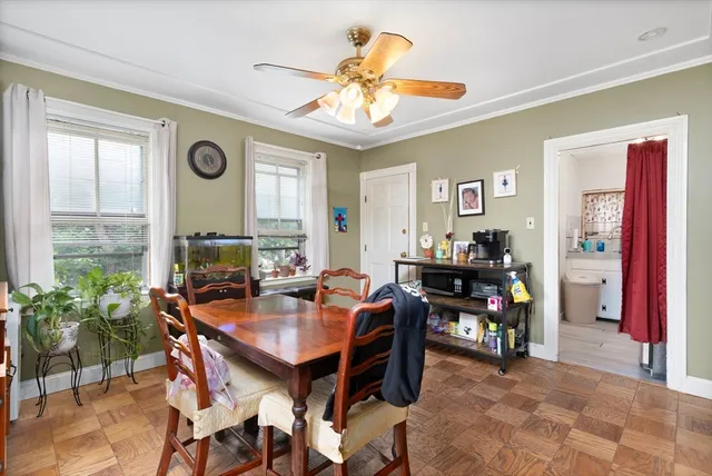 a dining room with furniture and window