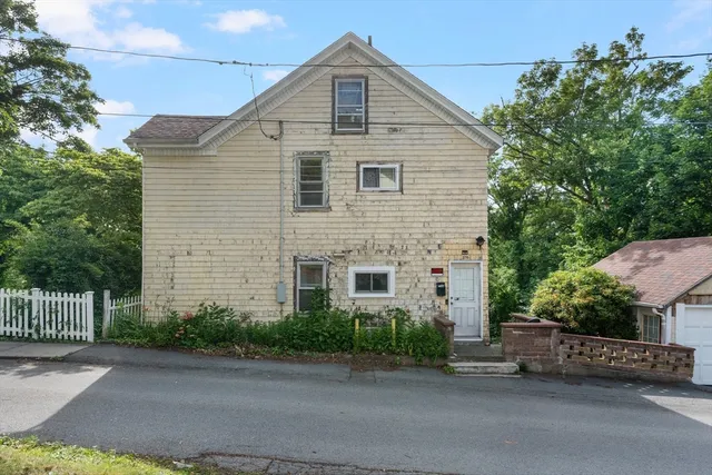 a front view of a house with garage