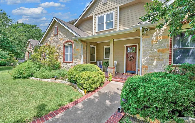 front view of a house with a yard