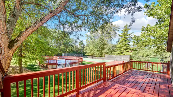 a view of a balcony with wooden floor