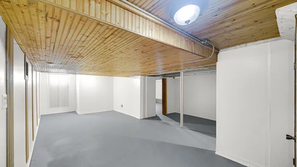 a view of a hallway with stairs