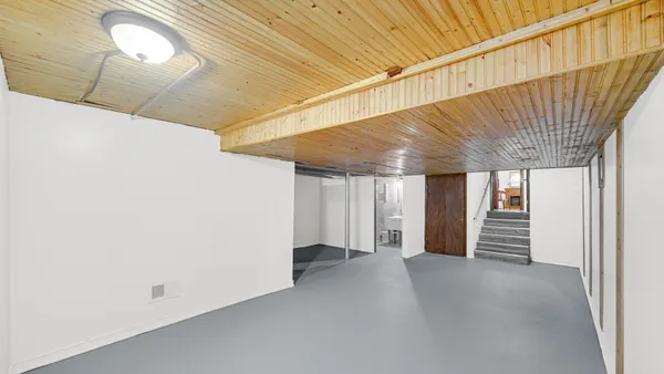 a view of a room with wooden walls